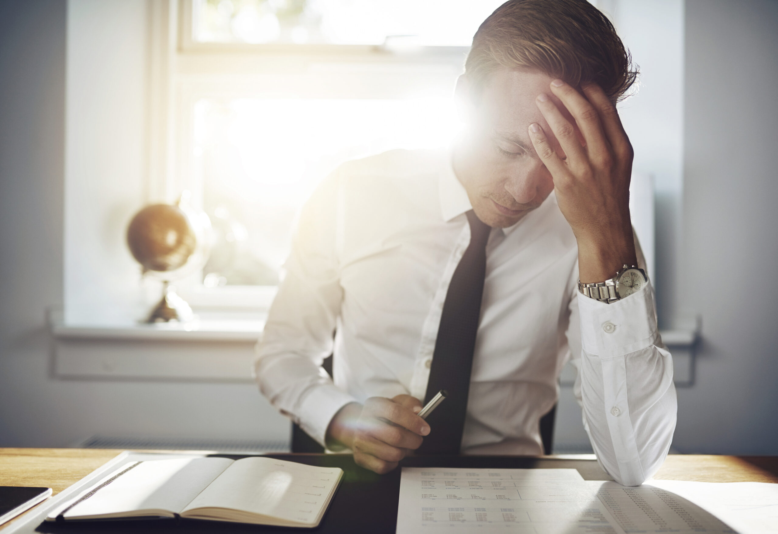 Business man working concentrated on documents Financial Difficulty