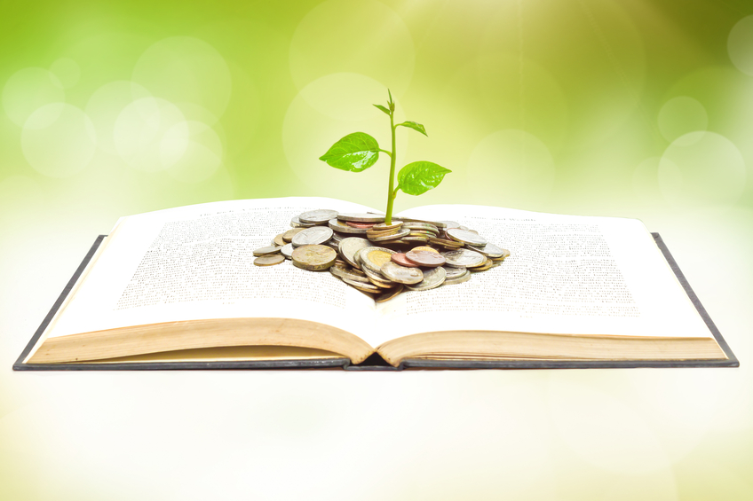 tree growing from book with coins Learning