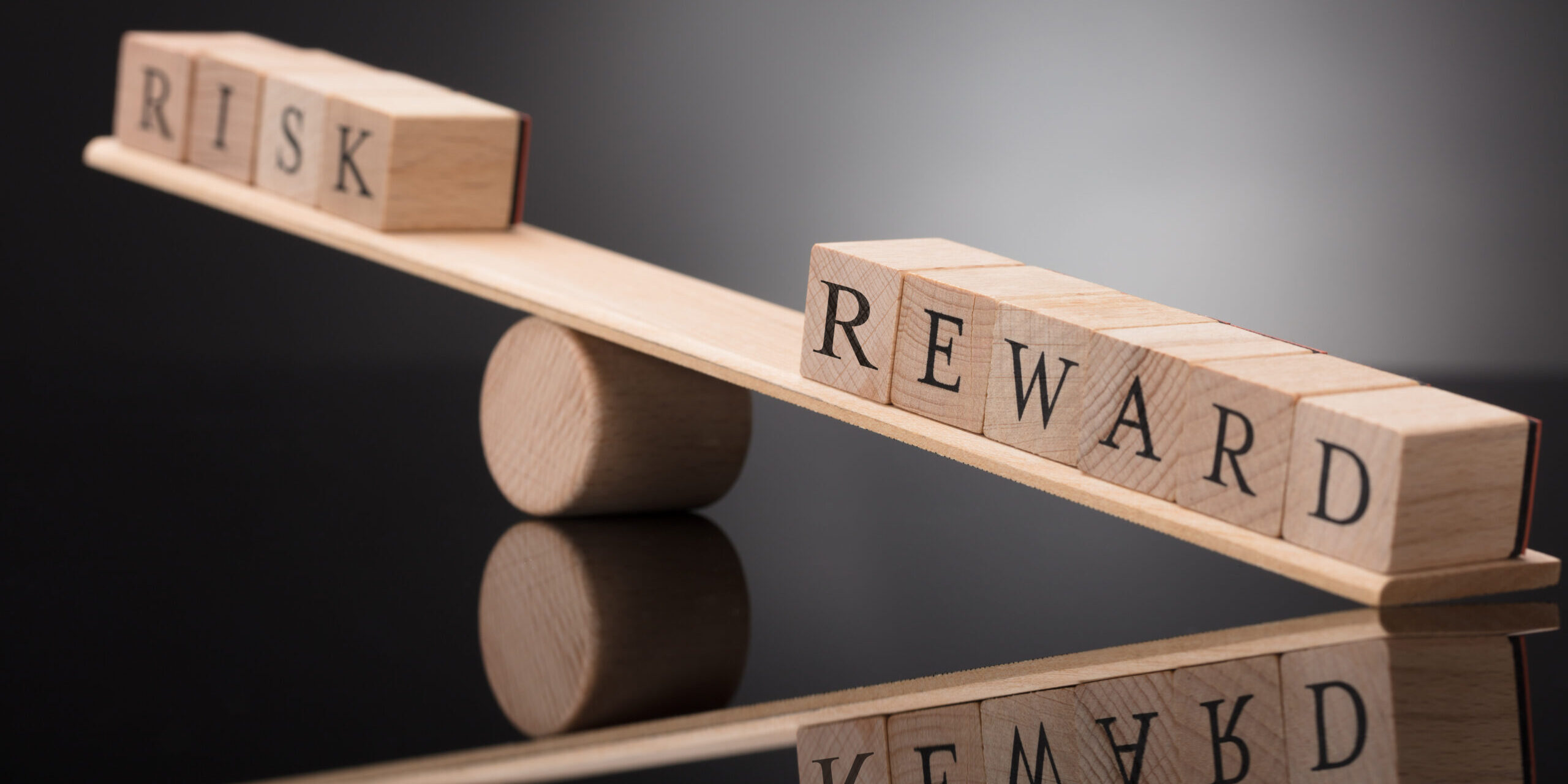 Seesaw Showing Imbalance Between Risk And Reward